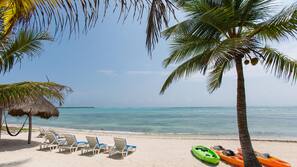 On the beach, sun loungers, beach towels