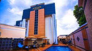 Outdoor pool, open 10:00 AM to 7:00 PM, pool umbrellas