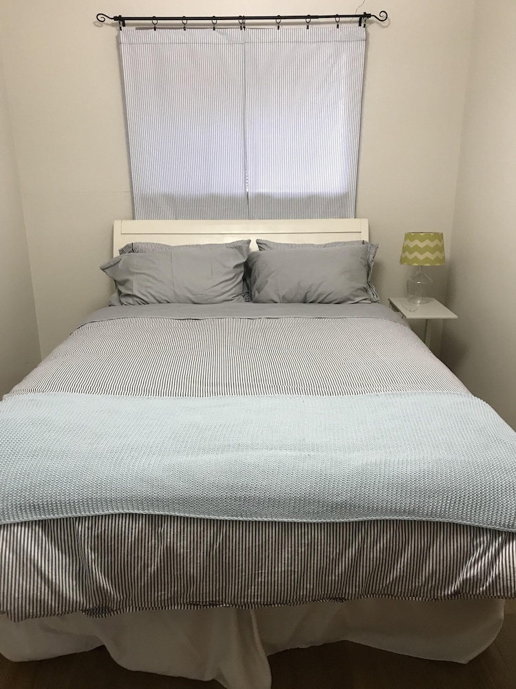 Beautiful Sylvan Lake waterfront property with unobstructed beach