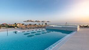 Indoor pool, seasonal outdoor pool, pool umbrellas, pool loungers