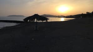 On the beach, sun loungers, beach towels