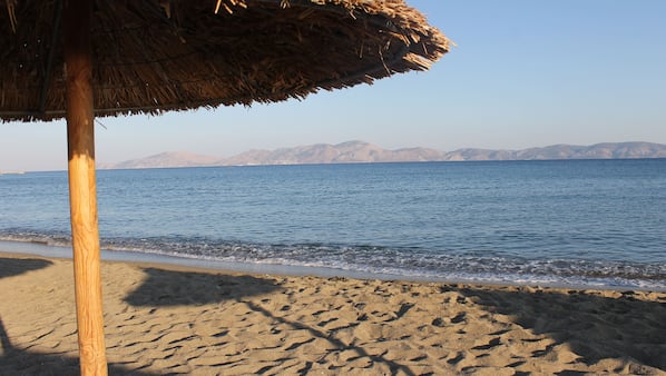 On the beach, sun loungers, beach towels