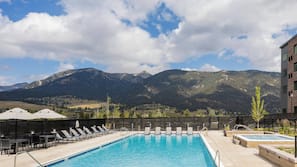 Outdoor pool, open 6:00 AM to 10:00 PM, pool umbrellas, sun loungers