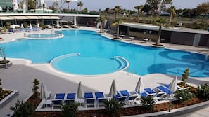 Indoor pool, outdoor pool, free pool cabanas, pool umbrellas