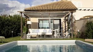 Seasonal outdoor pool, pool loungers