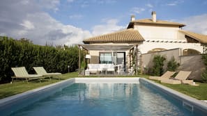 Seasonal outdoor pool, pool loungers