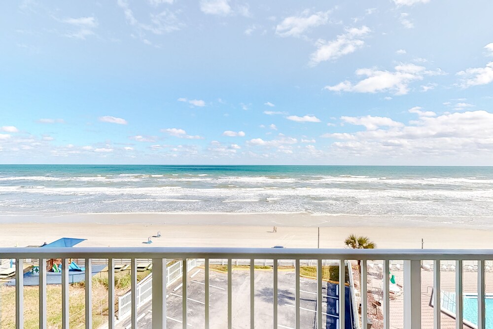 Condo w/ furnished balcony, shared pool, hot tub, game room, gym, & beach access