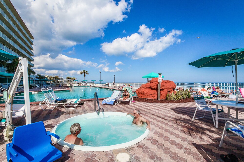 Condo w/ furnished balcony, shared pool, hot tub, game room, gym, & beach access