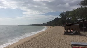 On the beach, sun-loungers, beach towels