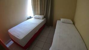 Frigobar, cortinas blackout, Wi-Fi de cortesia, roupa de cama