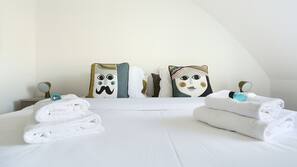 2 bedrooms, blackout curtains, iron/ironing board, cots/infant beds