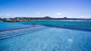 Outdoor pool, open 9:00 AM to 5:00 PM, pool umbrellas