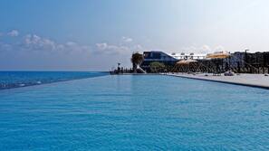 Outdoor pool, open 9:00 AM to 5:00 PM, pool umbrellas