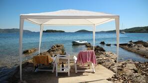 On the beach, sun-loungers, beach towels