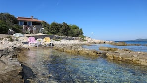 On the beach, sun-loungers, beach towels