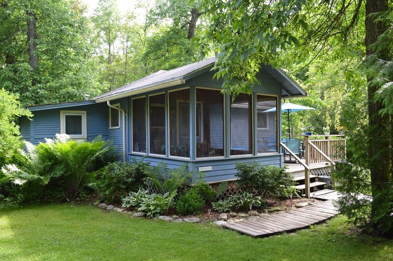 Get Away at This Quaint Cottage Tucked Behind a Beautiful Fern bed in Baileys Harbor, United States