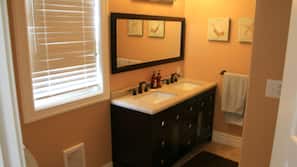 Bathtub, hair dryer, towels, soap