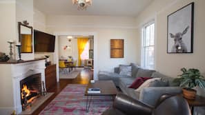 TV, fireplace, books, music library