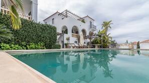 Outdoor pool, pool umbrellas, pool loungers