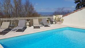 Seasonal outdoor pool, pool umbrellas, pool loungers