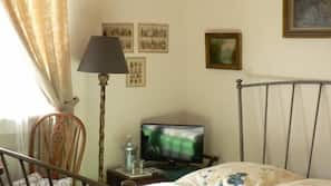 Hypo-allergenic bedding, desk, laptop workspace, blackout drapes