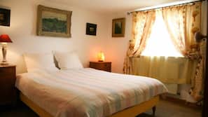 Hypo-allergenic bedding, desk, laptop workspace, blackout drapes