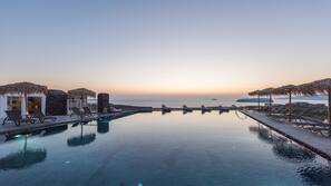 Seasonal outdoor pool, open 8:00 AM to 10:00 PM, pool umbrellas