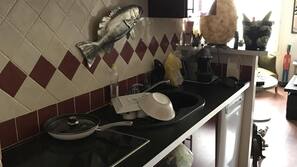 Microwave, dishwasher, coffee/tea maker, cookware/dishes/utensils