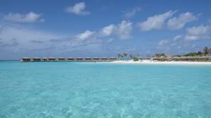 On the beach, white sand, free beach cabanas, sun-loungers