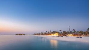 On the beach, white sand, free beach cabanas, sun-loungers