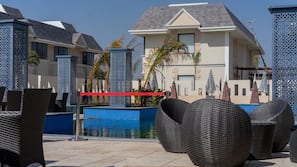 Outdoor pool, open 9:00 AM to 6:00 PM, pool umbrellas, sun loungers