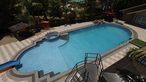 Outdoor pool, open 7:00 AM to 7:00 PM, pool umbrellas, pool loungers