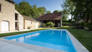 Seasonal outdoor pool, pool loungers