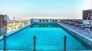 Outdoor pool, open 9:00 AM to 8:00 PM, pool loungers