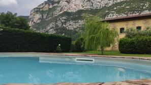 Seasonal outdoor pool, pool umbrellas, pool loungers
