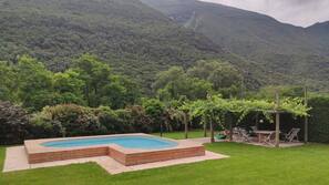 Seasonal outdoor pool, pool umbrellas, pool loungers