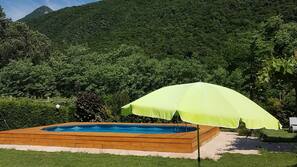 Seasonal outdoor pool, pool umbrellas, pool loungers