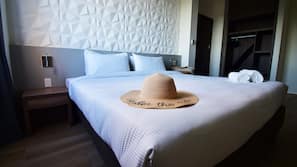Premium bedding, laptop workspace, blackout drapes, soundproofing
