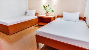Desk, iron/ironing board, bed sheets