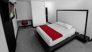 Premium bedding, desk, laptop workspace, blackout drapes