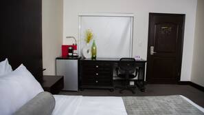 Premium bedding, desk, laptop workspace, blackout drapes