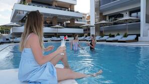 Seasonal outdoor pool, pool umbrellas, pool loungers