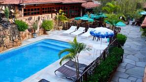 Outdoor pool, pool umbrellas, sun loungers