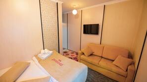 Premium bedding, desk, laptop workspace, blackout curtains