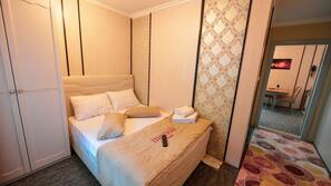 Premium bedding, desk, laptop workspace, blackout curtains