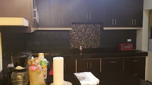 Dishwasher, coffee/tea maker, toaster, cookware/dishes/utensils