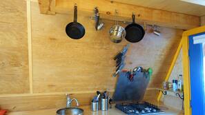Fridge, stovetop, coffee/tea maker, cookware/dishes/utensils