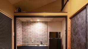 Full-size fridge, microwave, stovetop, cookware/dishes/utensils