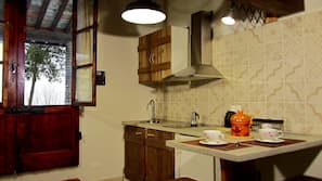 Full-size fridge, stovetop, espresso maker, coffee/tea maker