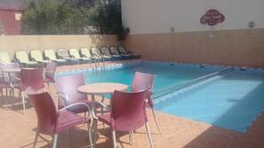 Outdoor pool, pool umbrellas, pool loungers